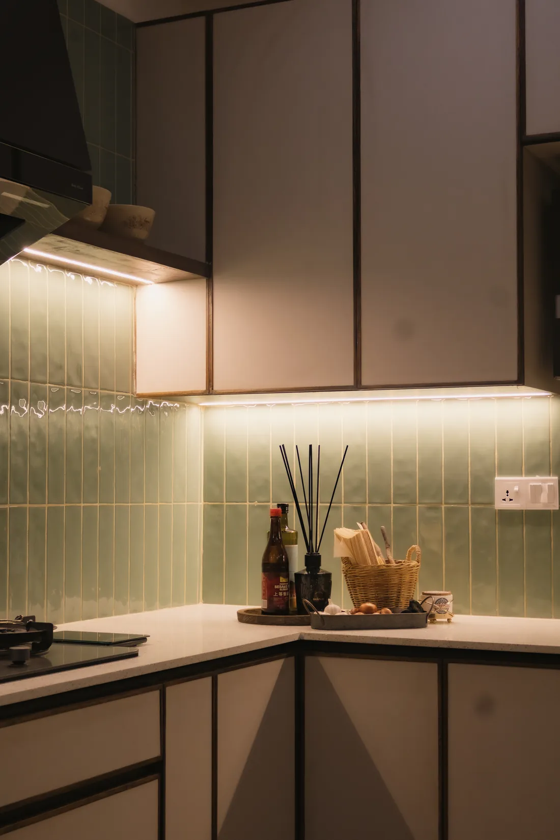 Sage green tiles and warm timber cabinetry in the Getaway Home kitchen